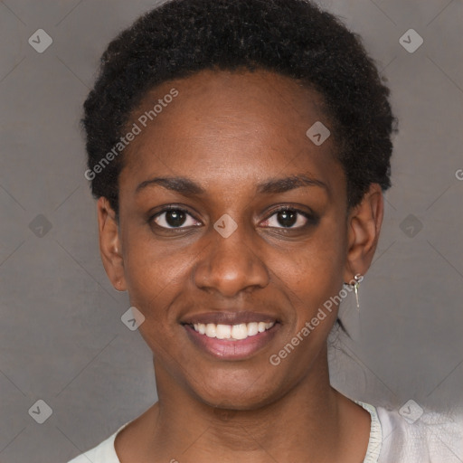 Joyful black young-adult female with short  black hair and brown eyes