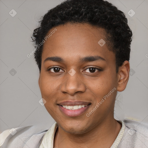 Joyful black young-adult female with short  black hair and brown eyes