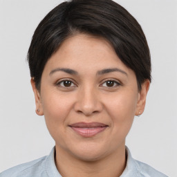 Joyful white young-adult female with short  brown hair and brown eyes