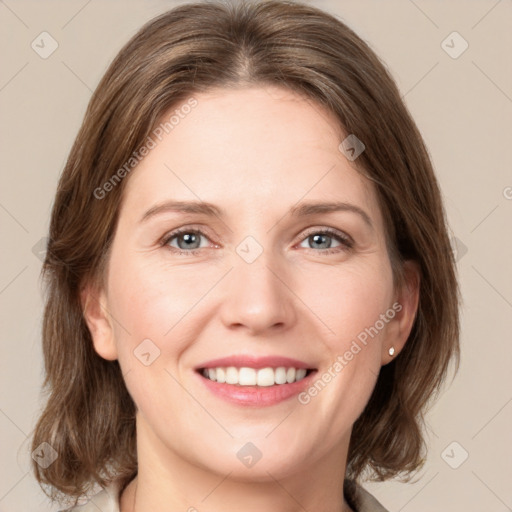 Joyful white young-adult female with medium  brown hair and grey eyes