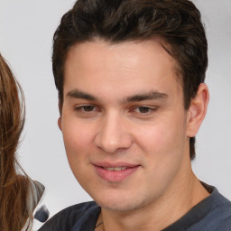 Joyful white young-adult male with medium  brown hair and brown eyes