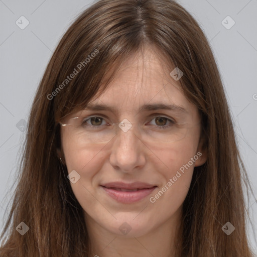 Joyful white adult female with long  brown hair and brown eyes