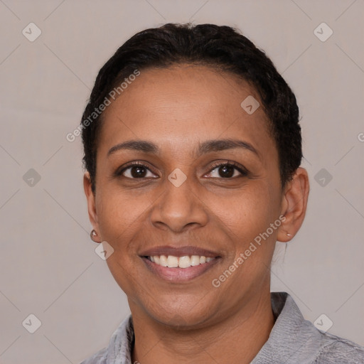 Joyful latino young-adult female with short  black hair and brown eyes