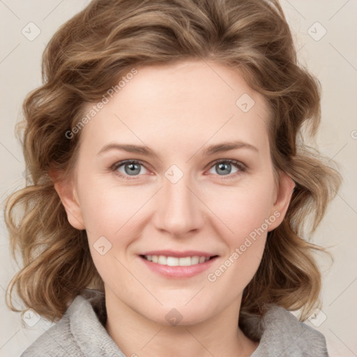 Joyful white young-adult female with medium  brown hair and blue eyes