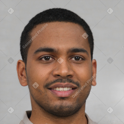 Joyful black young-adult male with short  brown hair and brown eyes