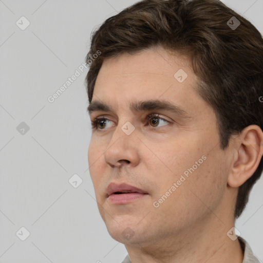 Neutral white young-adult male with short  brown hair and brown eyes