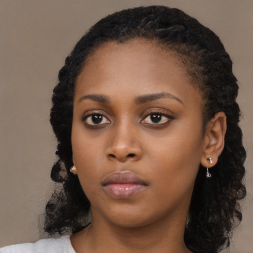 Neutral black young-adult female with long  black hair and brown eyes