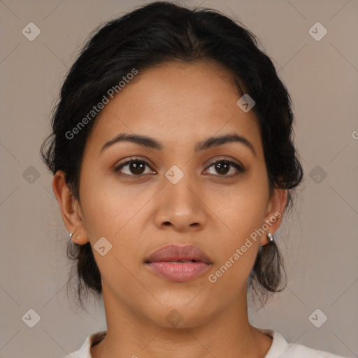 Joyful latino young-adult female with medium  brown hair and brown eyes