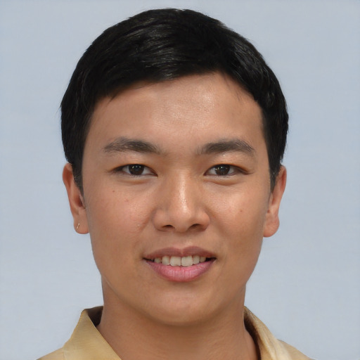 Joyful asian young-adult male with short  black hair and brown eyes