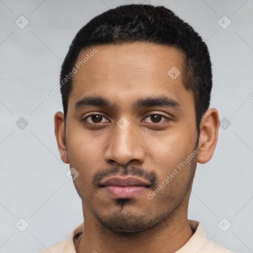 Neutral latino young-adult male with short  black hair and brown eyes