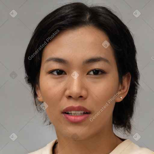 Joyful asian young-adult female with medium  brown hair and brown eyes