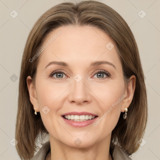 Joyful white adult female with medium  brown hair and grey eyes