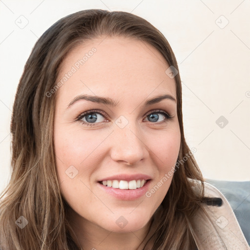 Joyful white young-adult female with long  brown hair and blue eyes