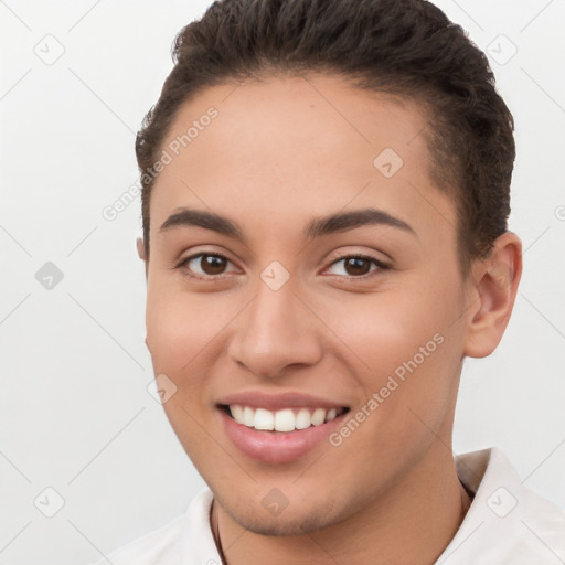 Joyful white young-adult female with short  brown hair and brown eyes