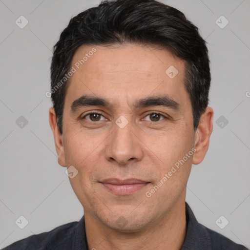 Joyful white adult male with short  black hair and brown eyes