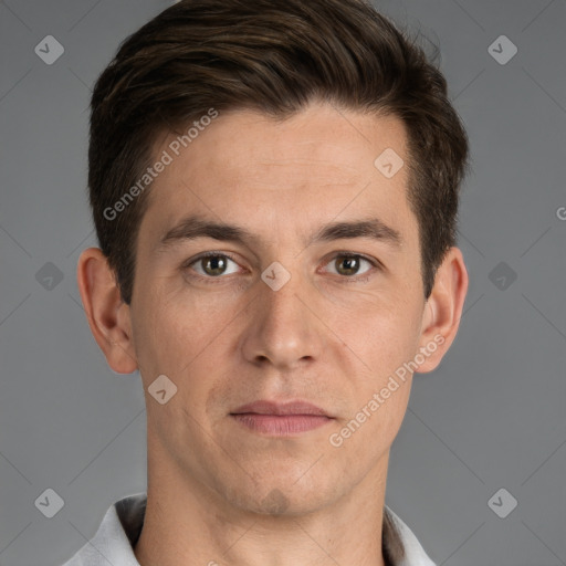 Joyful white adult male with short  brown hair and grey eyes