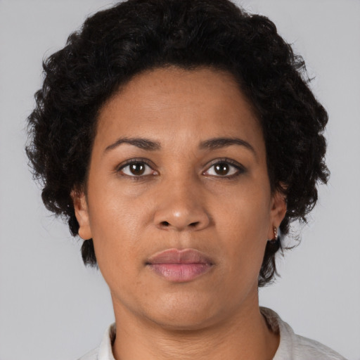 Neutral black young-adult female with short  brown hair and brown eyes