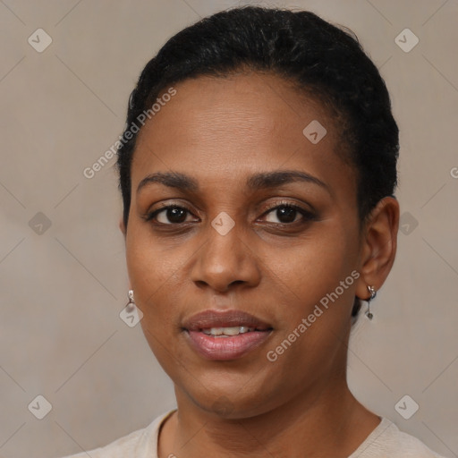 Joyful black young-adult female with short  brown hair and brown eyes