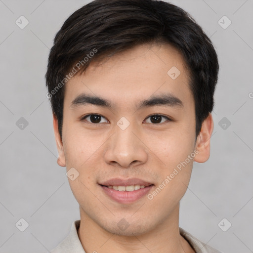 Joyful white young-adult male with short  black hair and brown eyes