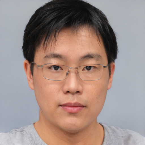 Neutral asian adult male with short  black hair and brown eyes