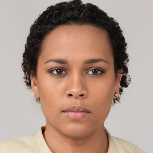 Neutral latino young-adult female with short  brown hair and brown eyes