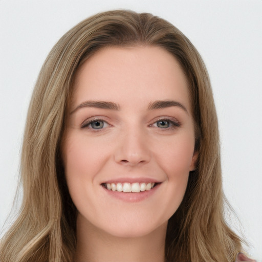 Joyful white young-adult female with long  brown hair and green eyes