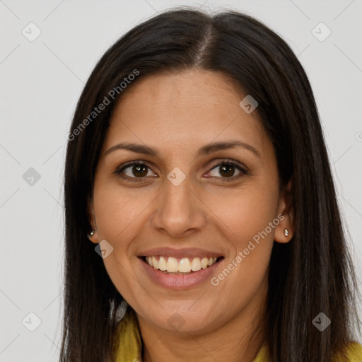 Joyful latino young-adult female with long  brown hair and brown eyes