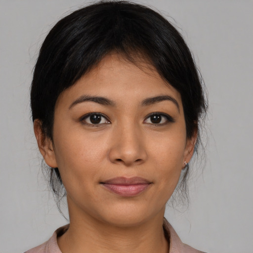 Joyful asian young-adult female with medium  brown hair and brown eyes