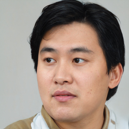 Neutral asian young-adult male with short  black hair and brown eyes