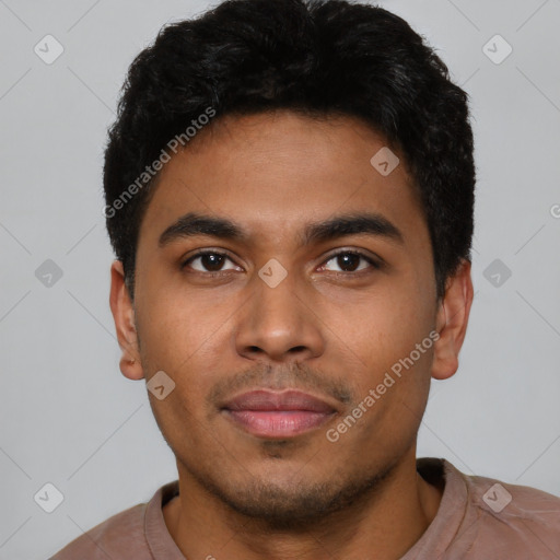 Joyful latino young-adult male with short  black hair and brown eyes