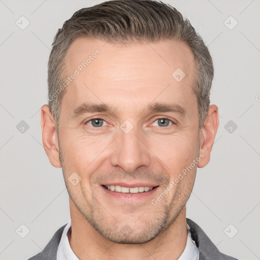 Joyful white adult male with short  brown hair and brown eyes