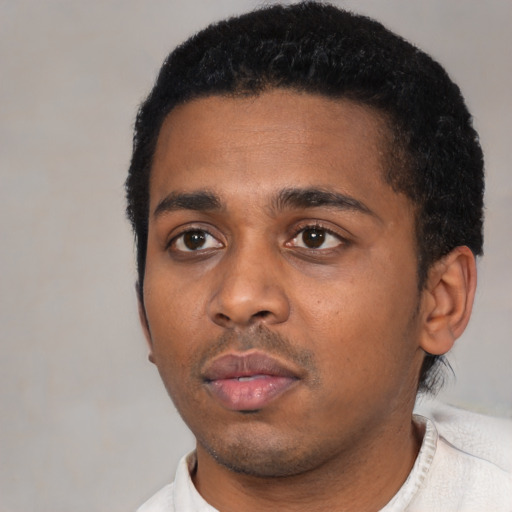 Neutral latino young-adult male with short  black hair and brown eyes