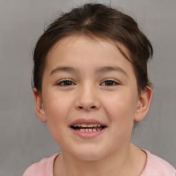 Joyful white child female with short  brown hair and brown eyes