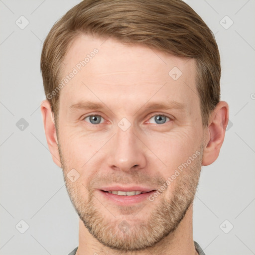 Joyful white adult male with short  brown hair and grey eyes