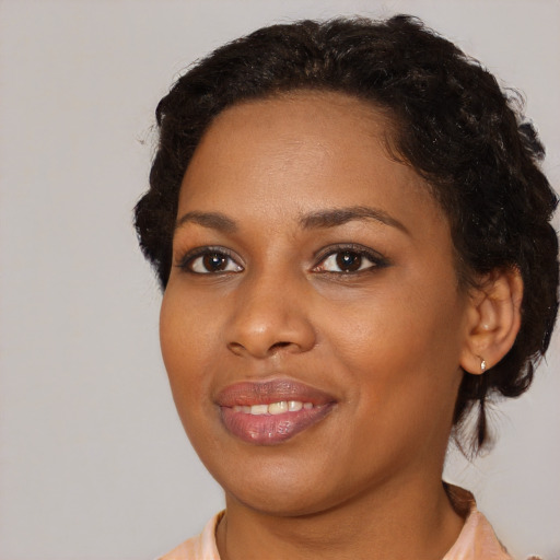 Joyful black young-adult female with medium  brown hair and brown eyes