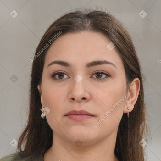 Neutral white young-adult female with long  brown hair and brown eyes