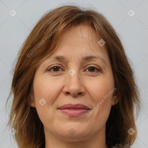 Joyful white adult female with medium  brown hair and brown eyes