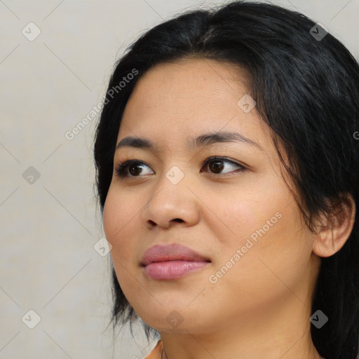 Joyful asian young-adult female with medium  black hair and brown eyes