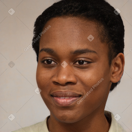 Joyful black young-adult female with short  black hair and brown eyes