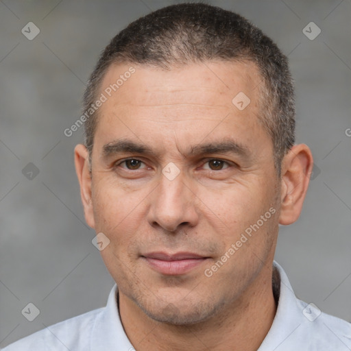 Joyful white adult male with short  brown hair and brown eyes