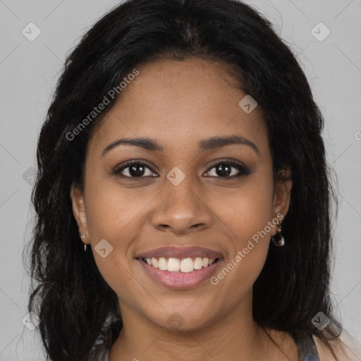 Joyful black young-adult female with long  brown hair and brown eyes