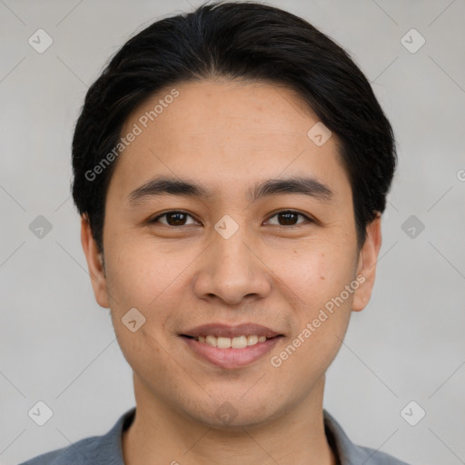 Joyful white young-adult male with short  black hair and brown eyes