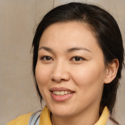 Joyful white young-adult female with medium  brown hair and brown eyes