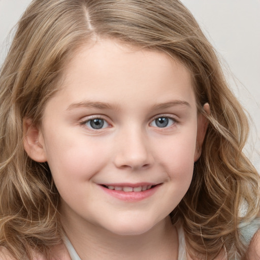 Joyful white child female with long  brown hair and grey eyes