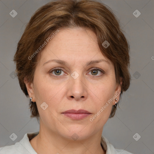 Joyful white adult female with medium  brown hair and grey eyes