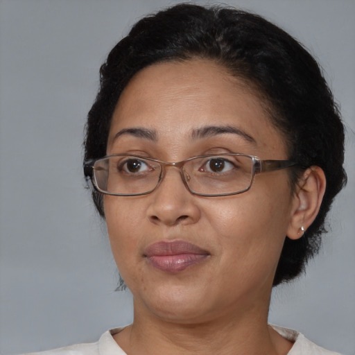 Joyful asian adult female with medium  brown hair and brown eyes