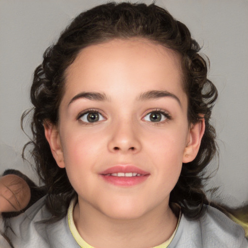 Joyful white child female with medium  brown hair and brown eyes