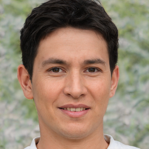 Joyful white adult male with short  brown hair and brown eyes