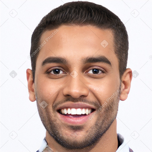 Joyful white young-adult male with short  black hair and brown eyes