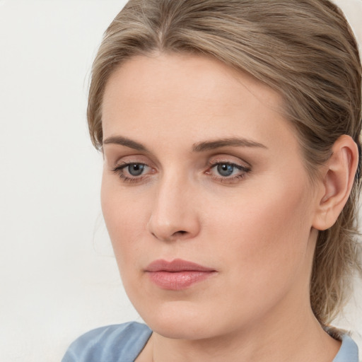 Neutral white young-adult female with medium  brown hair and blue eyes